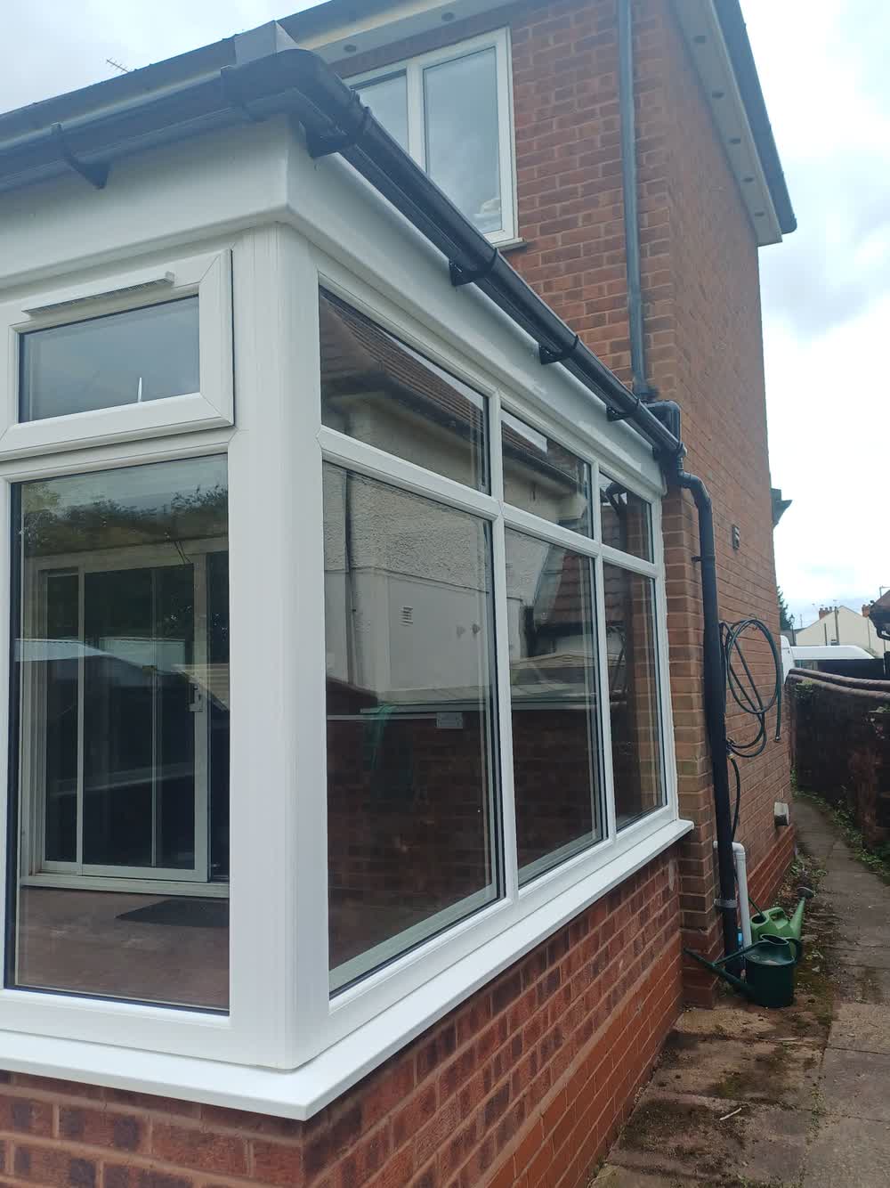 Tiled conservatory roof seen from the side, run down to the gutter line